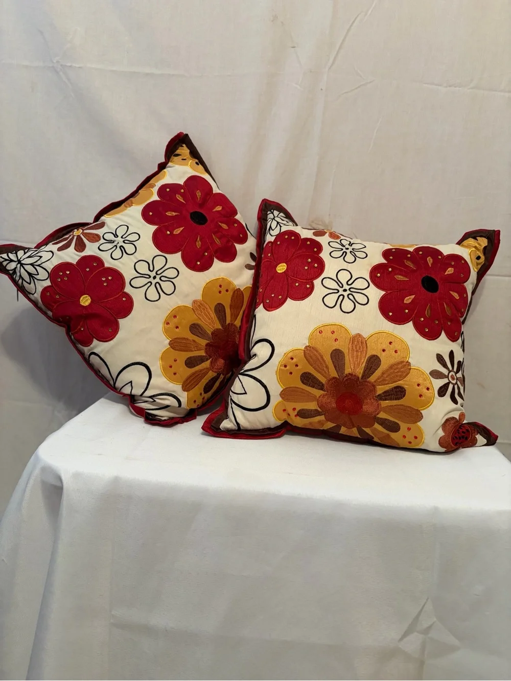 Pier 1 Imports pillows vibrant floral embroidery in red and gold
